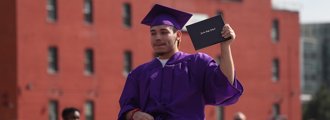 Student holding diploma